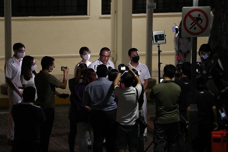 Communications and Information Minister S. Iswaran, surrounded by members of his PAP team for West Coast GRC, speaking to reporters in Clementi early this morning after their win against the Progress Singapore Party.