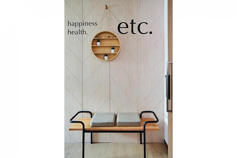 A decal made up of the words “happiness, health, etc” greets visitors at the home’s entrance.