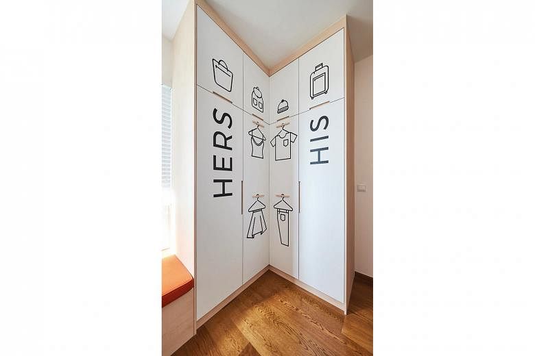 Like in other parts of the home, decals lend a playful touch, this time to the walk-in wardrobe.