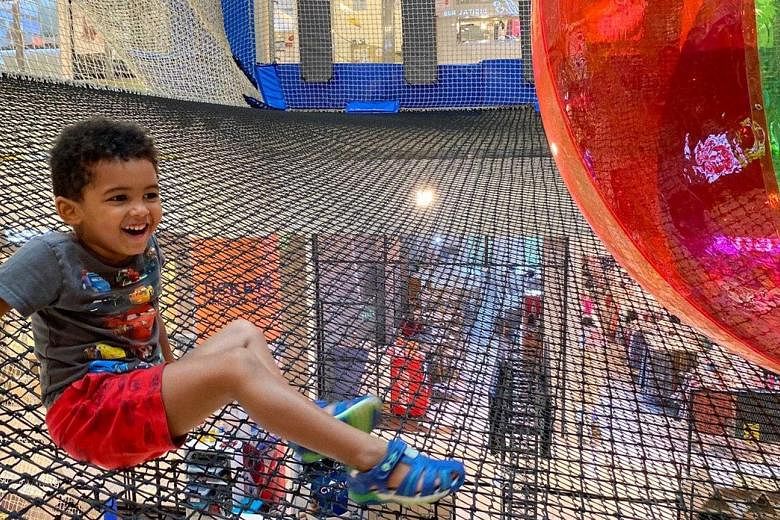 It is playtime for this child at Airzone, an indoor suspended net playground. 