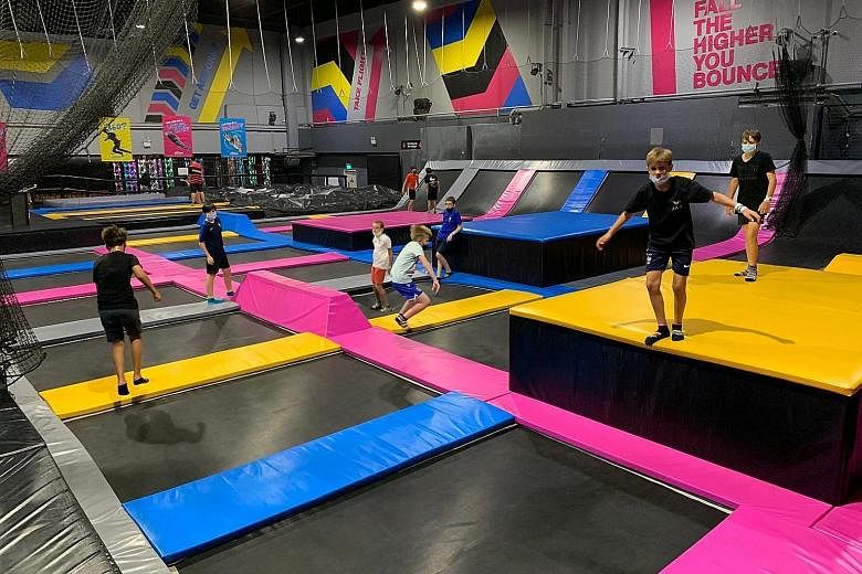 Visitors at the indoor trampoline park Bounce Singapore, which is operating with a new limited capacity. 