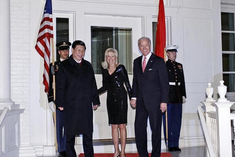 Then Chinese Vice-President Xi Jinping being welcomed by his US counterpart Joe Biden and his wife Jill to a dinner at the Naval Observatory in Washington in February 2012.