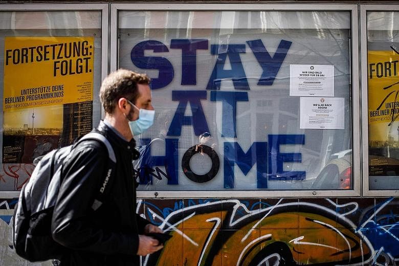 A cinema urging people to "Stay At Home" in Berlin's Kreuzberg district in April. A businessman from a car-parts company in Germany was the country's first coronavirus case on Jan 27. He had been infected by a colleague visiting from China, who had s