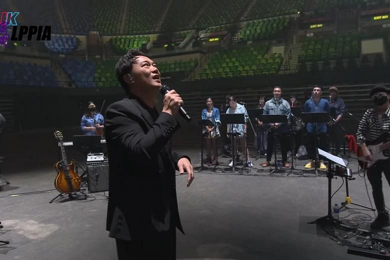 Hong Kong singer Eason Chan performs charity concert in empty stadium