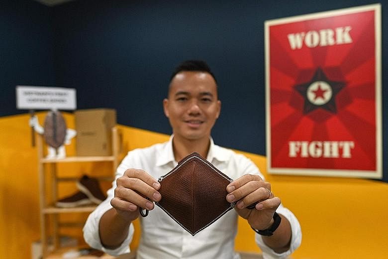 Entrepreneur Le Thanh with the face mask his firm, ShoeX, now makes from coffee waste. His cutting edge design uses woven fibre made from coffee grounds to make a washable outer layer, with a filter inside. 