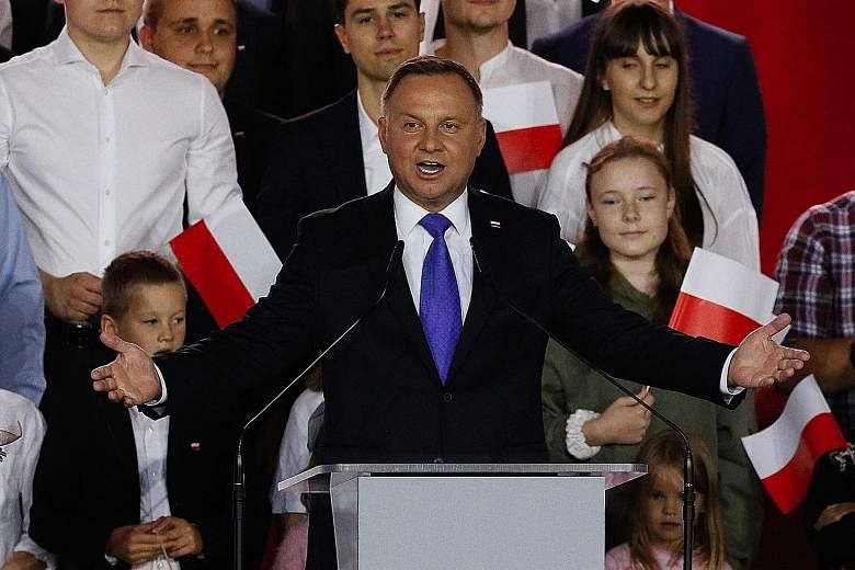 Polish President Andrzej Duda speaking to supporters on Sunday, soon after an exit poll showed he had won with a thin margin.