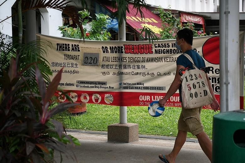 A banner in Sims Avenue last week showing the number of dengue cases in the area. There are over 370 active dengue clusters in Singapore, mostly in the east, with 133 considered high-risk. The biggest cluster is in the Bukit Panjang-Woodlands area, w