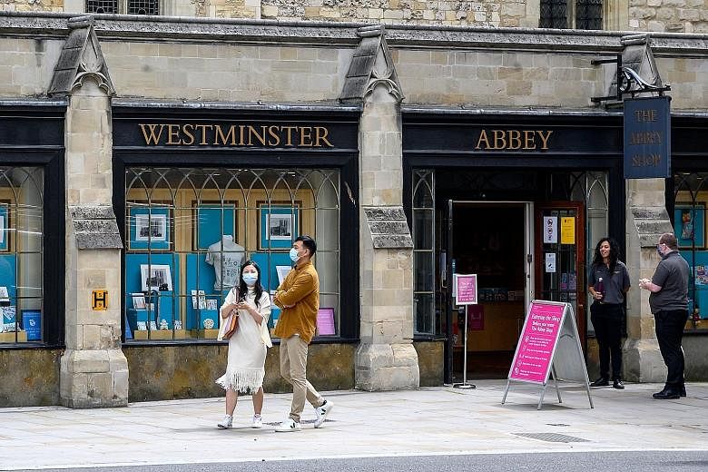 A gift shop at London's Westminster Abbey, which reopened to visitors over the weekend after four months of closure amid the pandemic. From July 24, face masks will be compulsory in shops and supermarkets in England, and people who fail to cover thei