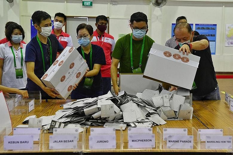 Election officials preparing to count the overseas votes in the presence of candidates from various parties yesterday.