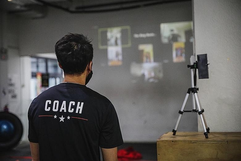 Hamzah Farouk of The Ring Boxing Community conducting a virtual class with members to give them "a more integrated experience". PHOTO: BACK ALLEY MEDIA