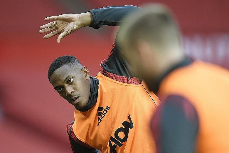 Manchester United's Anthony Martial warming up ahead of their 2-2 draw against Southampton at Old Trafford on Monday. The Frenchman has scored five goals in six league games since the season restarted. PHOTO: REUTERS
