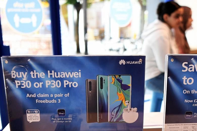 Huawei 5G phones on sale at a store in London. Britain this week pledged to remove Chinese telecommunications giant Huawei from its 5G network by 2027, despite warnings of retaliation from Beijing.