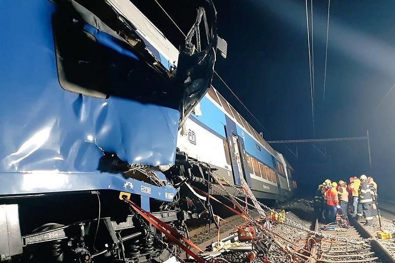 Rescuers at the accident site after a passenger train collided with a stationary freight train near the town of Cesky Brod in Czech Republic on Tuesday. The collision followed several other minor accidents on Czech railways over the past week.