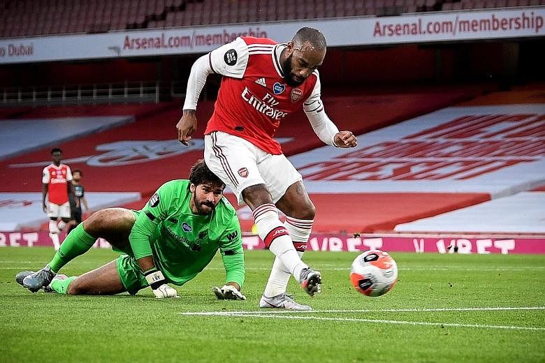 Arsenal forward Alexandre Lacazette beating Liverpool goalkeeper Alisson Becker to score the equaliser in their Premier League match at the Emirates on Wednesday. Arsenal went on to record a 2-1 win and become only the third team to beat the champion