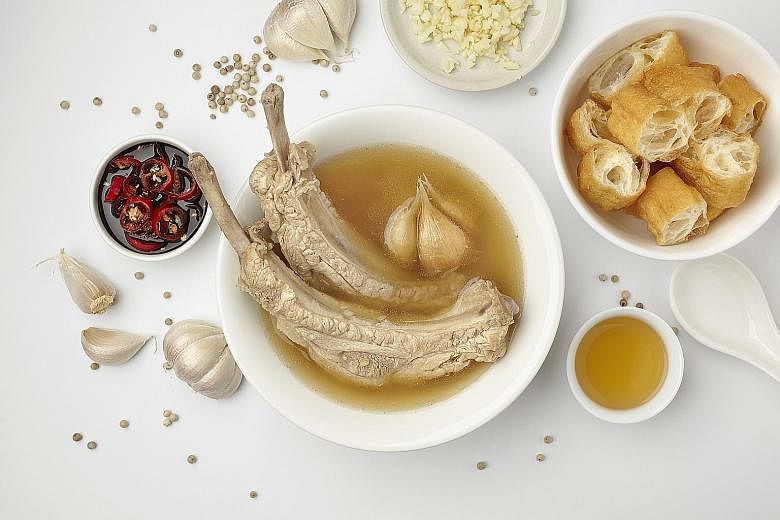 Known for its aromatic bak kut teh (left), Founder Bak Kut Teh was started in 1978 by Mr Chua Chwee Whatt (above, right, with his son Nigel Chua).