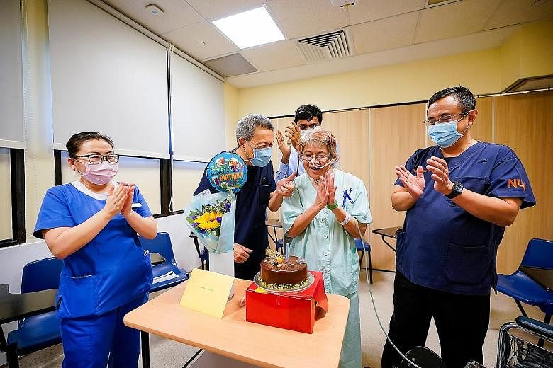 Madam Choy Wai Chee, who turns 58 today, celebrating her birthday in the National University Hospital on Friday, with the staff and doctors who tended to her. With her are (from left) nurse manager Kong Yingying, Professor Lim Tow Keang and assistant