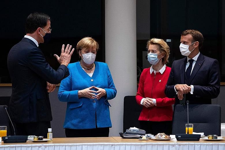 (From left) Dutch Prime Minister Mark Rutte, German Chancellor Angela Merkel, European Commission President Ursula von der Leyen and French President Emmanuel Macron meeting ahead of an EU summit at the European Council building in Brussels yesterday