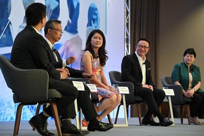 The panellists - (from left) SkillsFuture Singapore CEO Ong Tze-Ch'in; Pan Pacific Hotels Group CEO Choe Peng Sum; HRnetGroup executive director Adeline Sim; Ademco Security Group's group managing director Toby Koh; Greenpac CEO Susan Chong - discuss