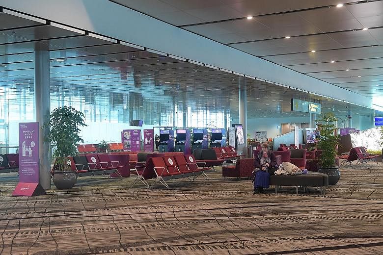 The transit holding area at Changi Airport Terminal 3 last month. Changi Airport Group said it has handled more than 10,000 transit passenger movements since the gradual reopening to transit flights on June 2, "though these still remain at very low l