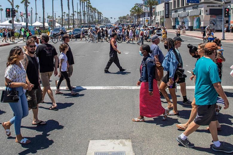 A busy street in Huntington Beach, California, on Sunday. The US state, another coronavirus hot spot in the country, has started to see its cases of infections and hospitalisations stabilising.