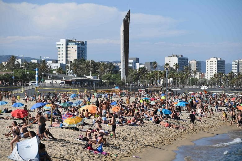 A packed beach in Barcelona, before the authorities closed it on Sunday. Since Spain lifted its state of emergency at the end of June, fresh outbreaks have appeared, especially in and around Barcelona and Lleida.