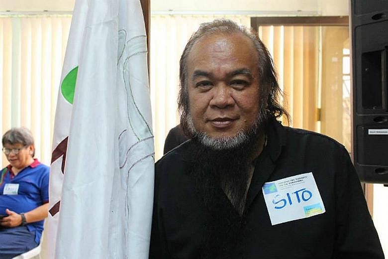 Father Teresito Soganub was with his family when he died of a cardiac arrest in his sleep yesterday in his home town in the war-torn Philippine island of Mindanao. PHOTO: PHILIPPINE INFORMATION AGENCY