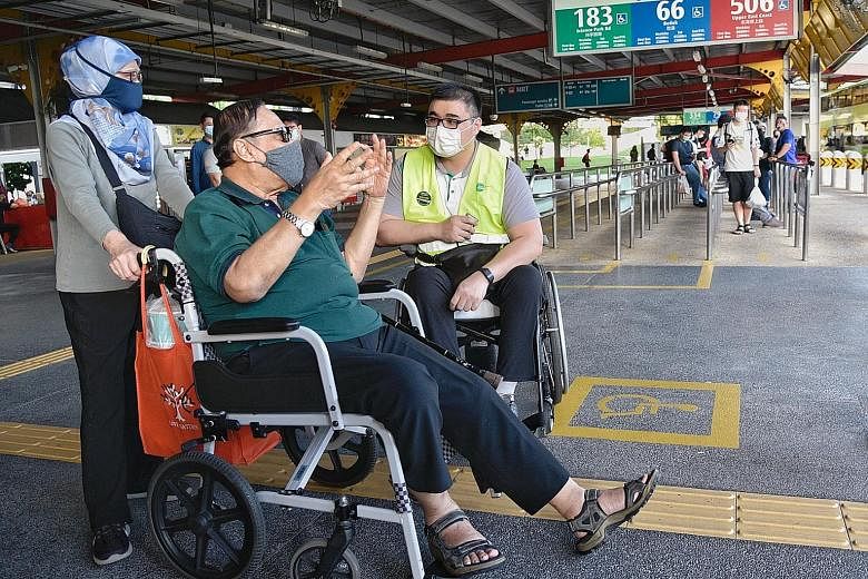 Wheelchair user Kishon Chong (right) gathering feedback from two bus commuters last Friday at Jurong East bus interchange. "This is a historic change," says the Public Transport Council chairman of Mr Chong's role as a customer experience and inclusi
