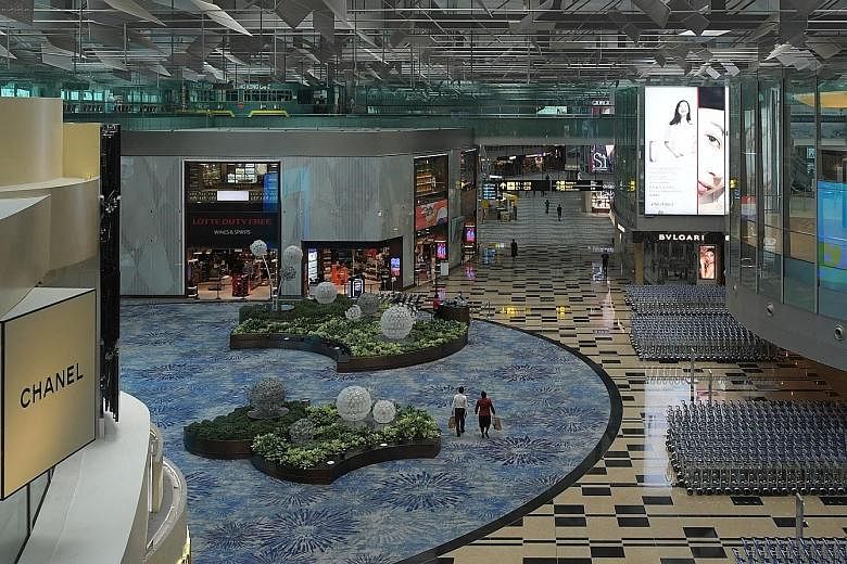A near-empty transit area in Changi Airport Terminal 3 in June. Professor Teo Yik Ying of the Saw Swee Hock School of Public Health said at the ST webinar that people are exposed to various factors beyond their control when they travel.