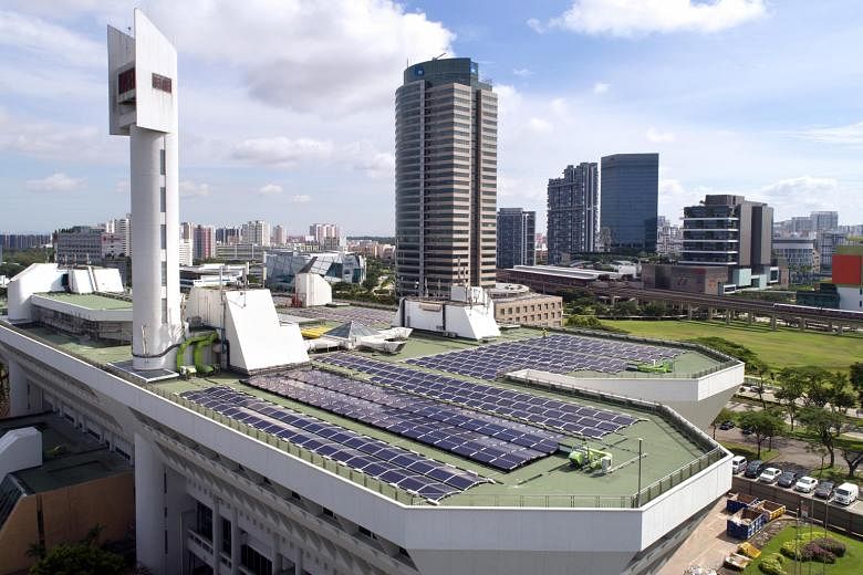 Solar panels on JTC's Jurong Town Hall rooftop. Singapore is on track to reach its solar energy generation target of 350 megawatt-peak by the end of this year, according to the Energy Market Authority. PHOTO: JTC