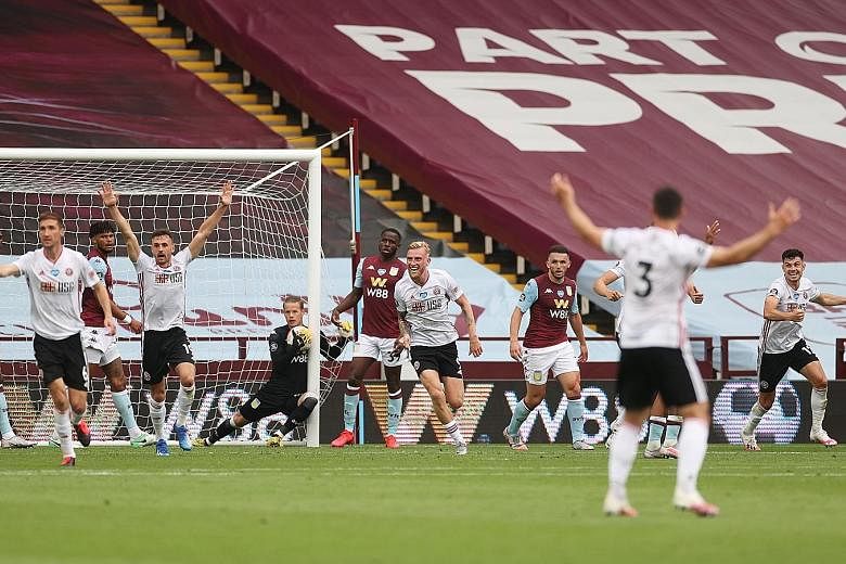 Sheffield United celebrating a goal against Villa prematurely on June 17. Goal-line technology failed to work and VAR could not intervene. 
