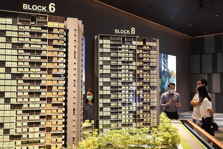 People at the Kopar at Newton show-flat on June 20, a day after show-flats were allowed to reopen. The 0.3 per cent rise in new private home prices in the second quarter stands in contrast to the 1 per cent decline in the first quarter, but analysts 