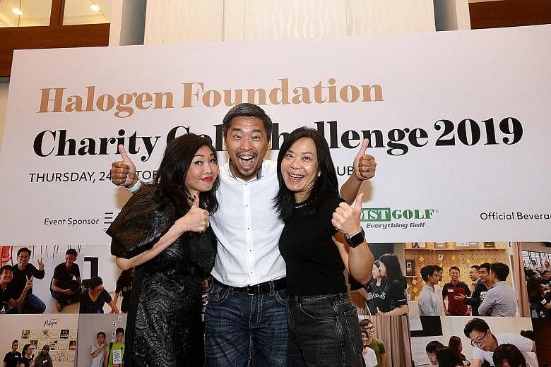 Dr Tan (right), with Halogen Foundation founder Martin Tan and fund raising co-chair Jessie Ho-Thong at a Halogen charity event last year.