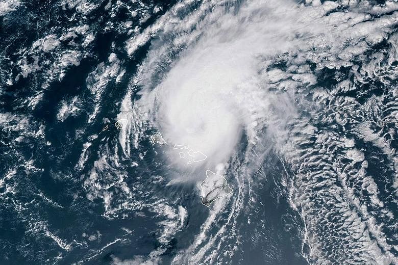 A satellite image showing Hurricane Douglas moving towards the west-north-west of Hawaii. If Douglas reaches the islands, it would be only the third hurricane in modern times to do so. The storm was expected to pass near the islands of Oahu and Kauai