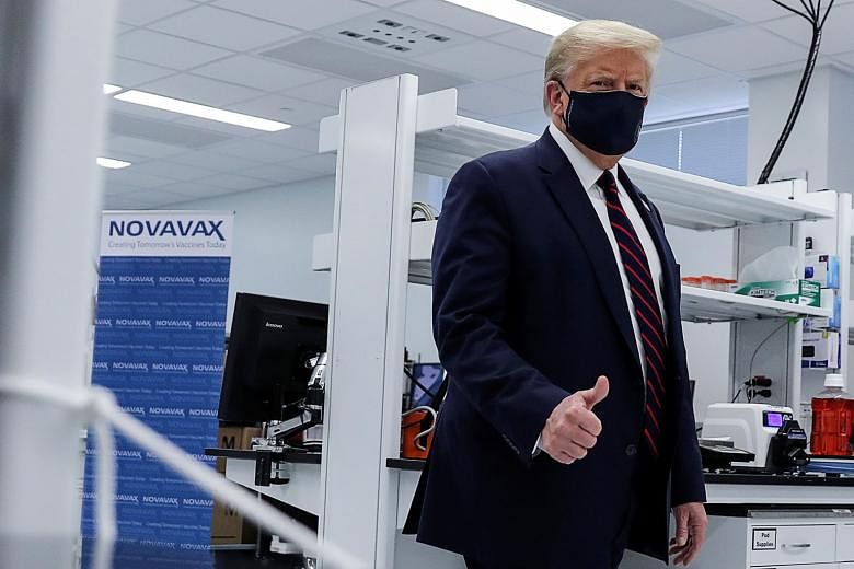 President Donald Trump touring the Fujifilm Diosynth Biotechnologies' Innovation Centre on Monday. The pharmaceutical plant in North Carolina is working on a potential coronavirus vaccine. PHOTO: REUTERS