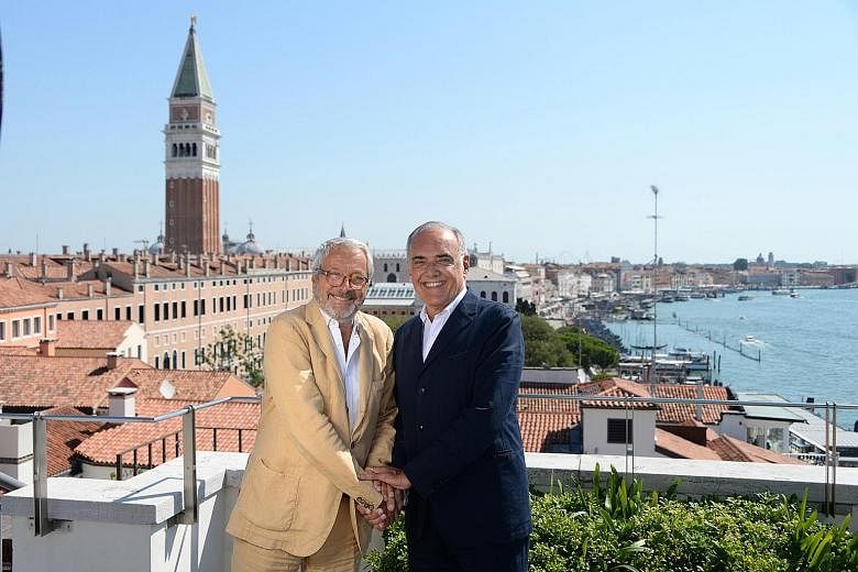 Festival director Alberto Barbera (left) and festival president Roberto Cicutto (far left) after a press conference for the 77th Venice International Film Festival on Tuesday. The event will go ahead in September with safety measures in place such as
