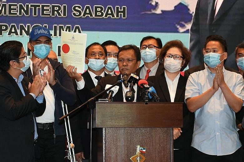 Sabah Chief Minister Shafie Apdal holding up the letter of dissolution of the state legislative assembly yesterday. An election has to take place within 60 days of the dissolution, and Datuk Seri Shafie will remain the caretaker chief until the polls