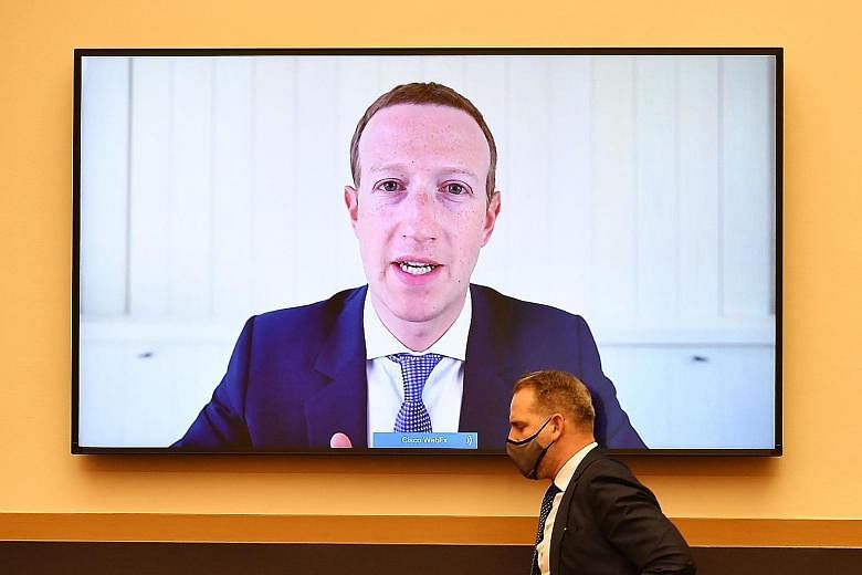 Mr Jeff Bezos (left) and Mr Tim Cook responding to a slew of questions from US lawmakers. Tech chiefs Mark Zuckerberg (left) and Sundar Pichai testifying via video conference on July 29.