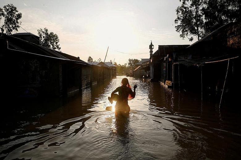 A flooded road in Jamalpur, Bangladesh, last month. The country is already witnessing a pattern of more severe and more frequent river flooding than in the past along the mighty Brahmaputra River, scientists say, and that is projected to worsen in th