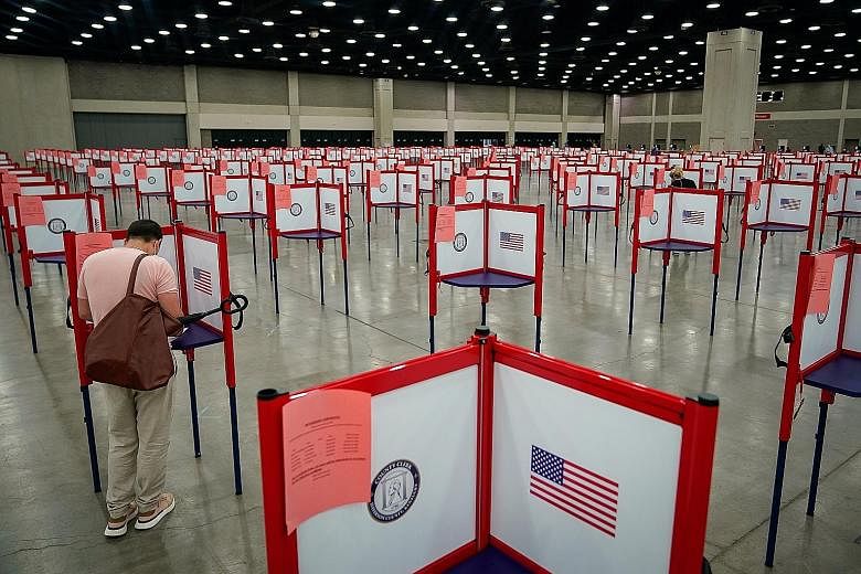 A voter on the day of the primary election in Kentucky on June 23. If Mr Donald Trump wins a second term, he can be expected to continue his "America First" unilateral policy, abandoning more global organisations and showing disdain for traditional a