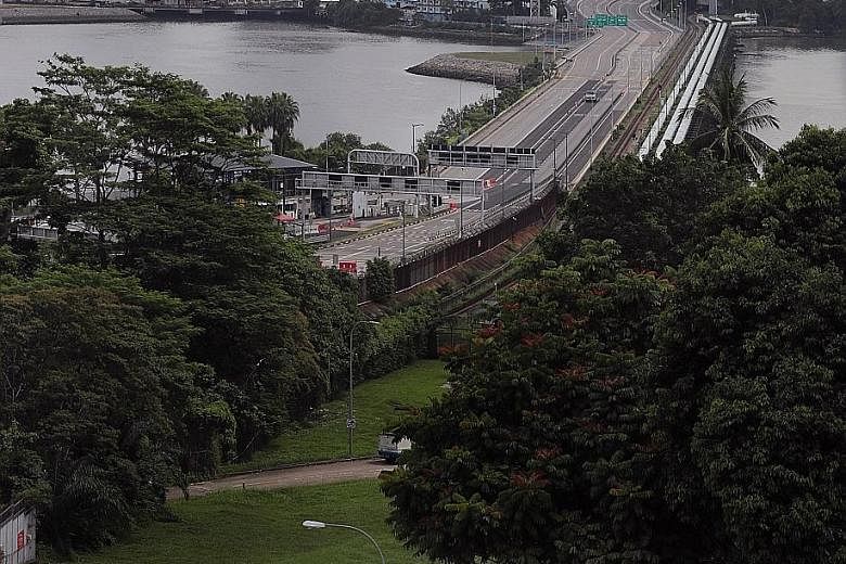 The empty Causeway on July 26. Some Malaysian students studying at Singapore universities are willing to bear quarantine costs and the 1km walk across the Causeway to return to campus, while others will continue with online classes or defer their sem