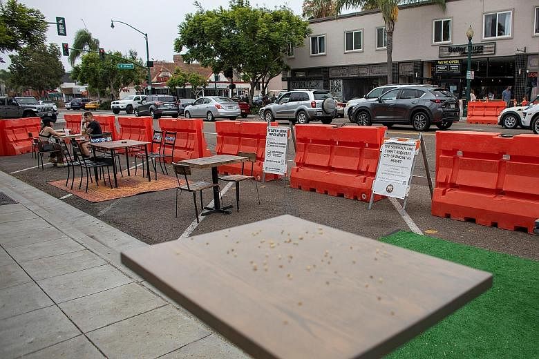 To help keep restaurants open, dining space has been made available along Highway 101 in Encinitas, California. Polls consistently show that the federal government's handling of Covid-19 has significantly hurt President Donald Trump's re-election cha