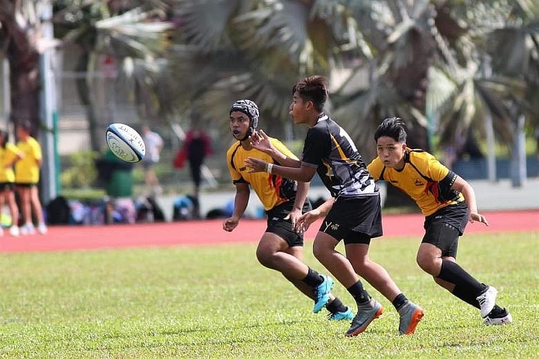 Jared Khuan (right) taking on Peirce Secondary School on Feb 3 in Bukit Batok Secondary's only B Division rugby game this year. The Sec 4 student was banking on good performances in the competition to secure a place at St Andrew's Junior College via 