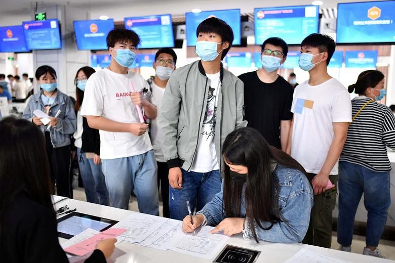 A job fair for college graduates in Bozhou city, in China's Anhui province. A UOB report says 19.3 per cent of new Chinese graduates are jobless. PHOTO: REUTERS