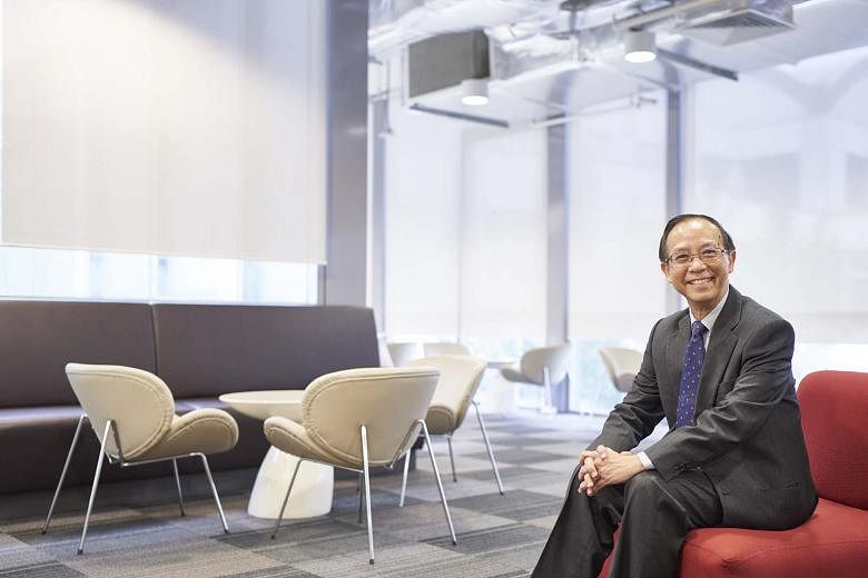 SUSS president Cheong Hee Kiat (above) said the university is in discussions with the Ministry of Education about a new campus, although its location has not been decided. It is now operating on rented premises (right) in Clementi.