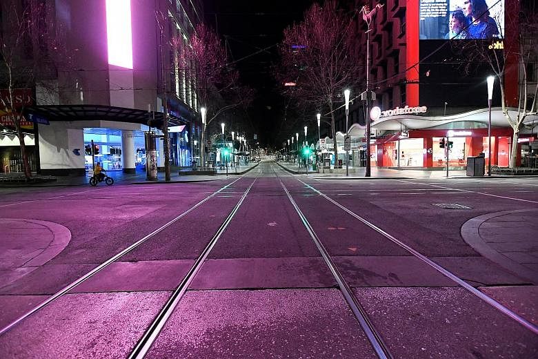 A deserted Bourke Street in Melbourne's city centre on Sunday, after a citywide curfew was introduced. Victoria's Premier Daniel Andrews said yesterday that he was forced to impose "radical" measures for the next six weeks despite the severe impact o