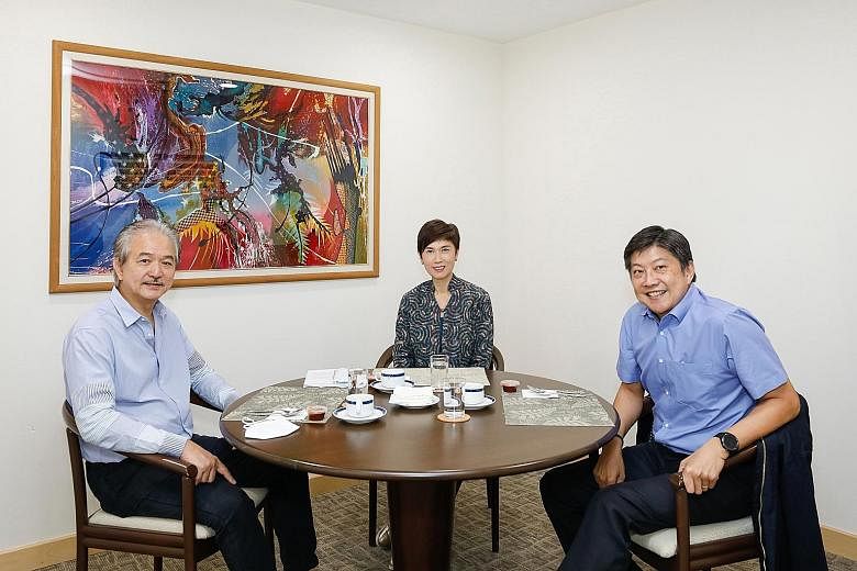 NTUC secretary-general Ng Chee Meng (right) at a meeting last week with Manpower Minister Josephine Teo and Singapore National Employers Federation president Robert Yap.