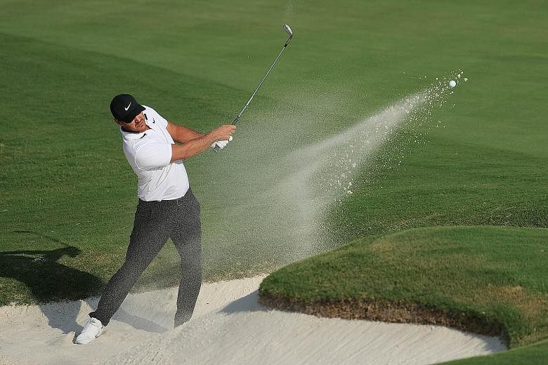 Brooks Koepka playing a shot from a bunker on the 18th hole during the final round of the WGC-FedEx St Jude Invitational on Sunday. He finished tied second and believes he is peaking just in time for his PGA Championship title defence.