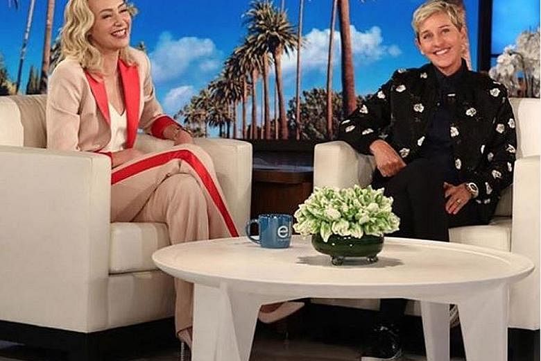 Actress Portia de Rossi (above, left) with host Ellen DeGeneres in an episode of her talk show.