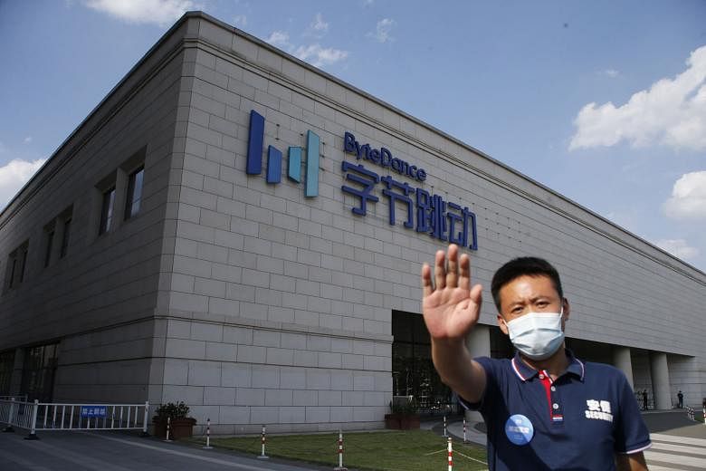A security guard outside ByteDance's headquarters in Beijing, China. The company owns TikTok, which is being threatened with a ban by the US. PHOTO: EPA-EFE