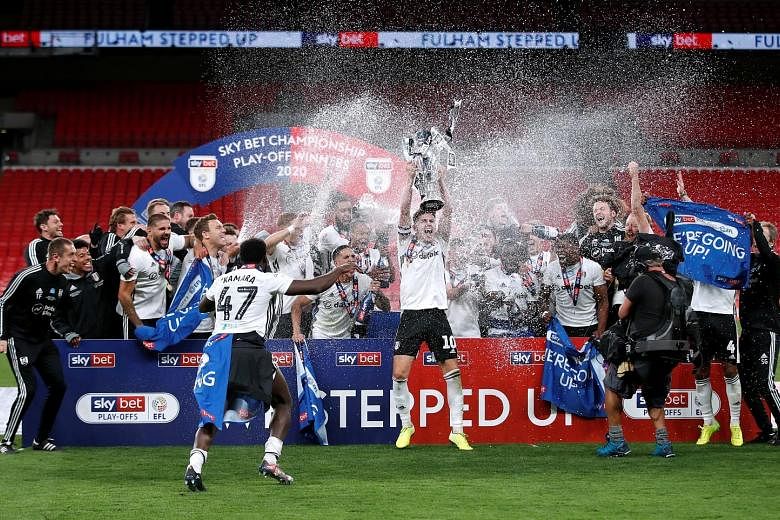 Fulham celebrating after beating London rivals Brentford 2-1 in the Championship play-off final behind closed doors at Wembley on Tuesday.
